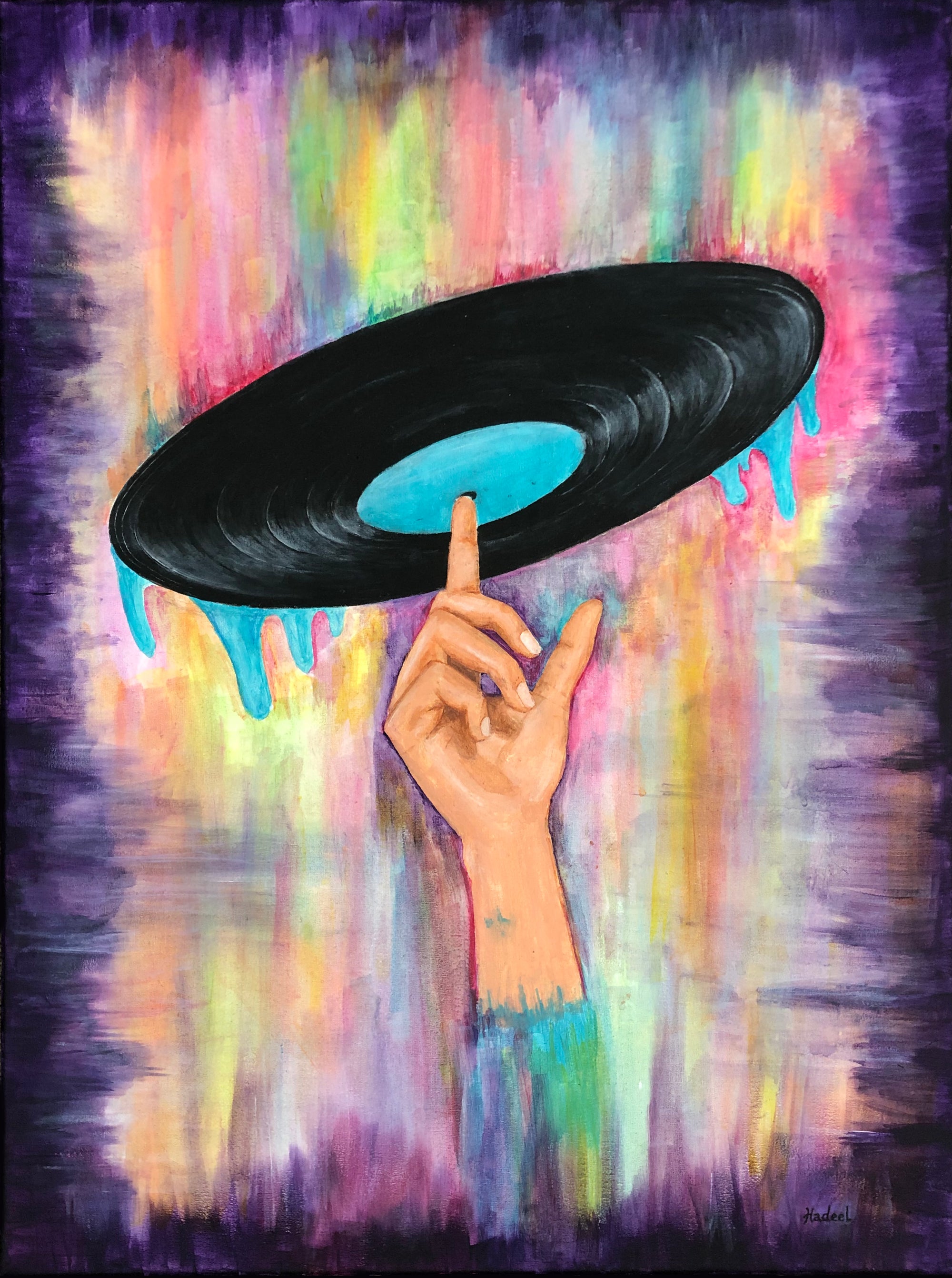 Vinyl record held by a hand against a colorful abstract background